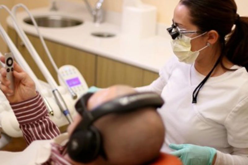 Dr. with dental implants patient